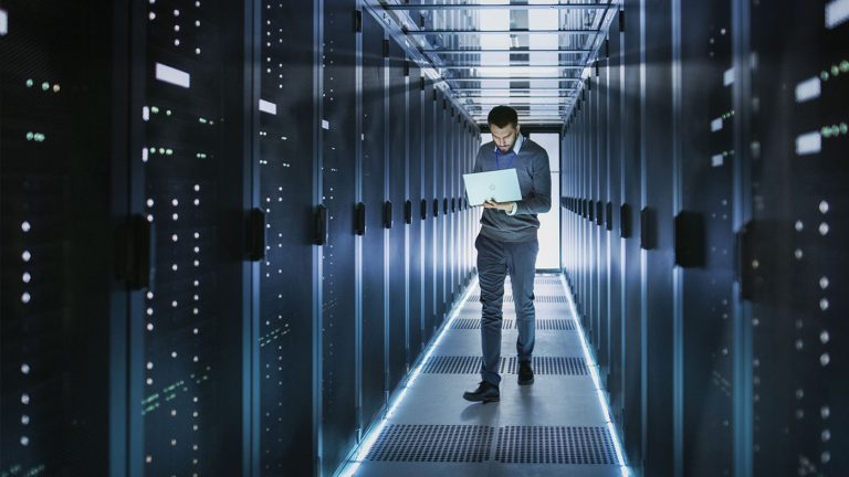 man walking down servers hallway